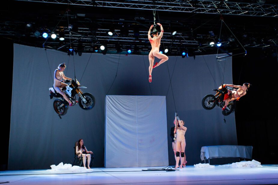 Five women performing a show