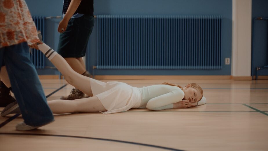 A teenager lying on the floor